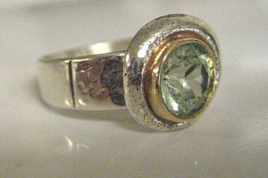 14K yellow gold, hand textured sterling silver ring featuring green spinel.