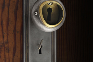 Doorknob with keyhole interior behind antique lens