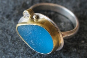 Turquoise sea glass with gold and diamond.