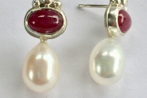 Silver earrings with ruby cabochons and white freshwater pearls